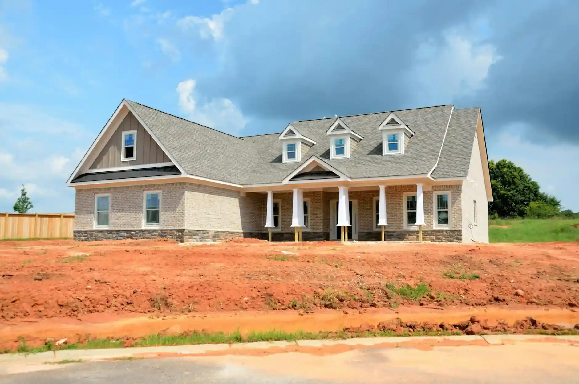 Smith Roofing project manager reviewing work on a Knoxville residential job site
