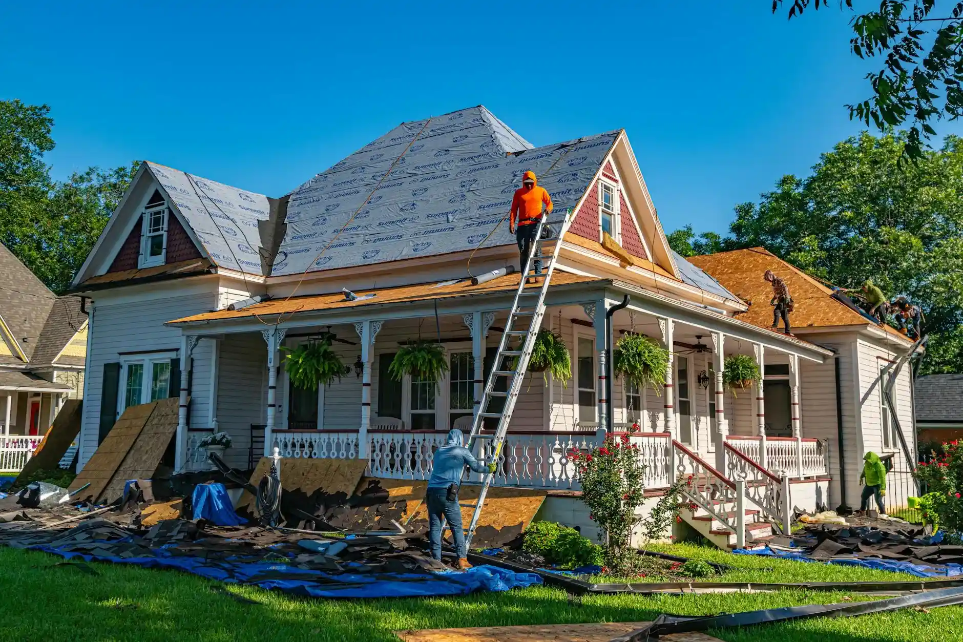 Roofers working on a residential roof replacement in Knoxville, TN